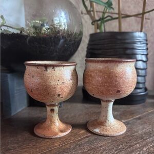 Set of 2 pottery handmade goblet wine glasses.  Holds approx 8 oz.
